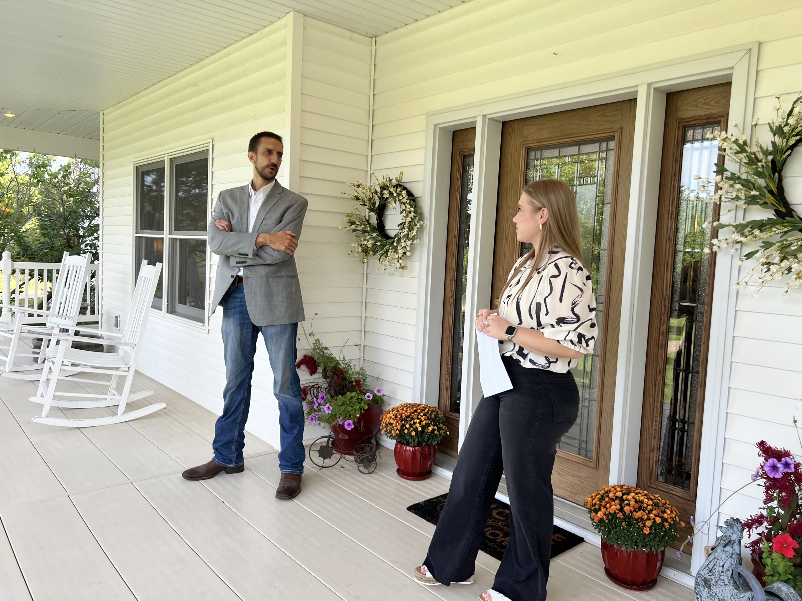 faith correll and mike wilken agents with agri affiliates at a real estate property showing